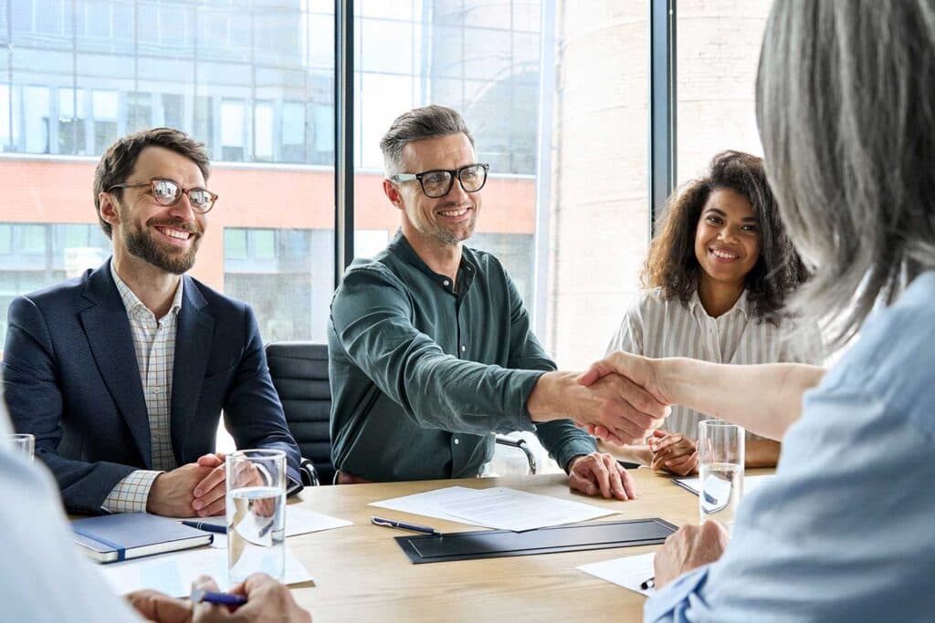 Business professionals shaking hands